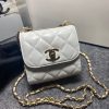 CHANEL Mini CC Clutch with Chain. Authentic Quality Clutch with literature, dust bag, box, CHANEL fabric flower, and authenticity card. This trendy CHANEL CC Clutch with Chain is crafted from quilted lambskin leather, features woven-in leather chain strap, logo metal plate, and aged gold-tone hardware. Its turn-lock closure opens to a black fabric interior with slip pockets.